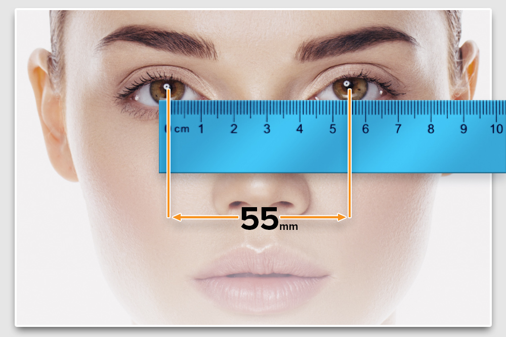 image of a set of eyes with a metric ruler overtop showing the distance between pupils